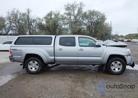 2015 Toyota Tacoma Base V6 z USA, uszkodzony, nr VIN 3TMMU4FN4FM075340